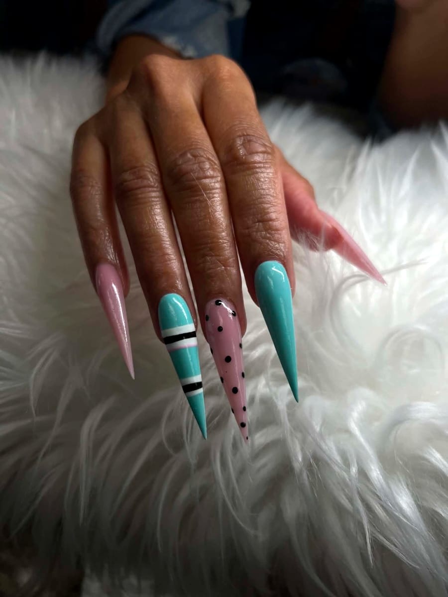 Extra-long pink and mint stiletto nails with stripe and polka-dot accent